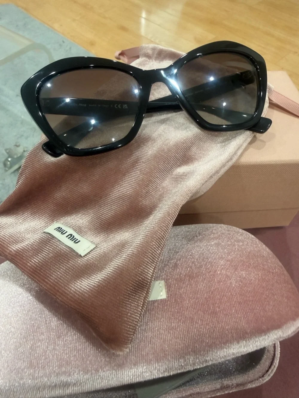 Miu Miu Black Cat-Eye Sunglasses with Dark Lenses